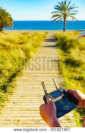 Percheles Beach, Spain - March 16, 2019: Drone Pilot Navigating Dji Drone Mavic Pro Platinum With Re