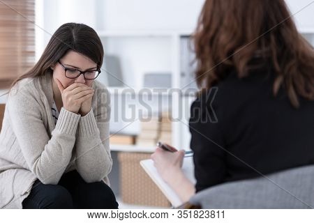 Sad Woman Crying During Psychotherapy At Professional Clinic