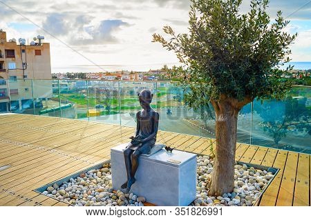 Paphos, Cyprus - February 15, 2019: The Girl And The Sparrow Sculpture At The Touristic View Point, 