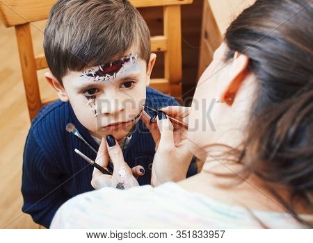 Little Cute Child Making Facepaint On Birthday Party, Zombie Apocalypse Facepainting, Halloween Prep