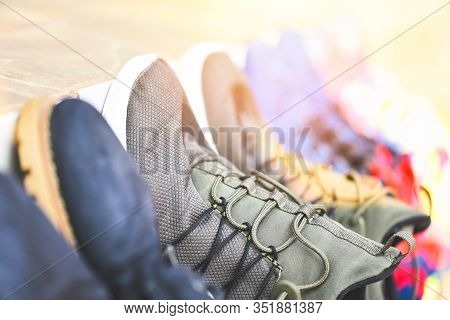 Sneakers Stand In A Line For Sale Second Hand Shoes Or Wash Shoes Dry / Canvas Shoes , Selective Foc