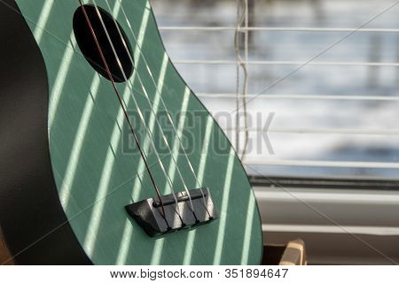 Close Up Of A Part Of Ukelele Guitar.