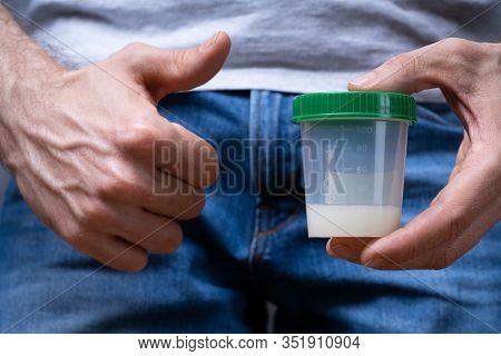 Sperm Donor Holding Container And Making Thumbs Up