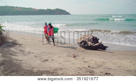 Morjim, India December 14, 2019: Cleaners Establish Order On Seacoast From Garbage. Workers Make Cle