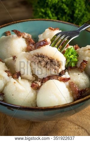 Meat Stuffed Potato Dumplings With Fried Onion And Greaves.