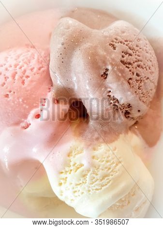 Closeup Image Of Three Elting Ice Cream Balls