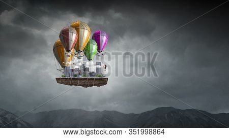 Aerostat high in sky . Mixed media