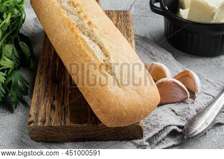 Ingredients For Garlic And Gerbs Bread Baguette Set, On Gray Stone Table Background