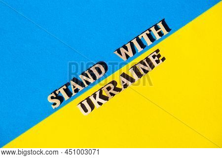 Ukrainian National Flag Made Of Paper. Stand With Ukraine Text. Stop War. The Concept Of Ending The 