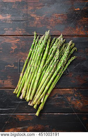 Raw Organic Asparagus On Dark Wooden Old Background, Top View