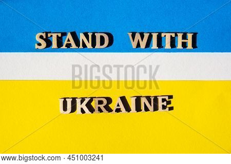 Ukrainian National Flag Made Of Paper. Stand With Ukraine Text. Stop War. The Concept Of Ending The 