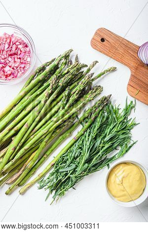 Raw Asparagus Eggs And French Dressing Ingredients With Dijon Mustard, Onion Chopped In Red Vinegar 
