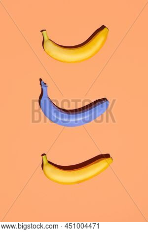 Minimal Flat Lay Of Three Bananas On Pastel Colored Background, Vegan Diet Concept, Copy Space