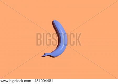 Minimal Top View Of Single Banana In Periwinkle Blue On Pastel Background, Vegan Diet Concept, Copy 