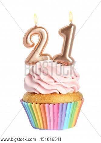Delicious Cupcake With Number Shaped Candles On White Background. Coming Of Age Party - 21th Birthda