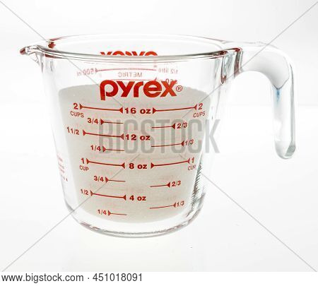 Winneconne, Wi -11 March 2021: A Package Of Pyrex Measuring Cup On An Isolated Background