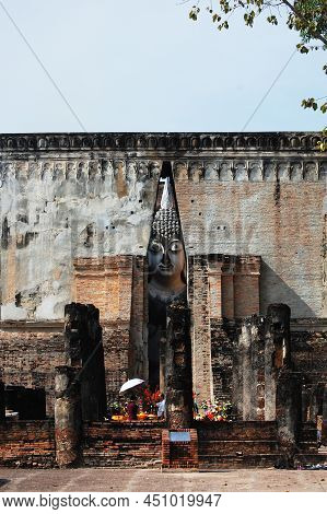 Ancient Ruin Building Of Wat Si Chum Temple And Pra Ajana Buddha Statue For Thai People Travel Visit
