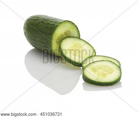 A Chopped Mini Cucumber On A White Background