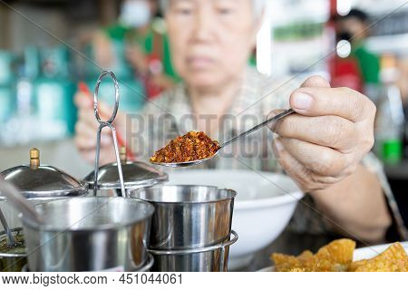 Old Elderly Eat Food That Tastes Hot Spicy,add Flavor To Food With Chili Powder From Condiment,asian