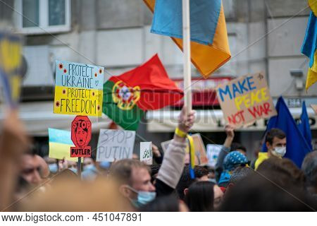 Lisbon, Portugal - February 27, 2022: Crowd With Paper Placards, Cardboard Banners With Texts Agains