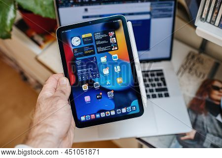 Paris, France - Oct 25, 2021: Pov Male Hand Holding New Latest Ipad Mini Pro Professional Showing Al