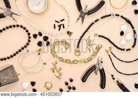 Tools And Accessories For Diy Jewelry In The Workplace. Flat Lay On Beige Background. Creative Flat