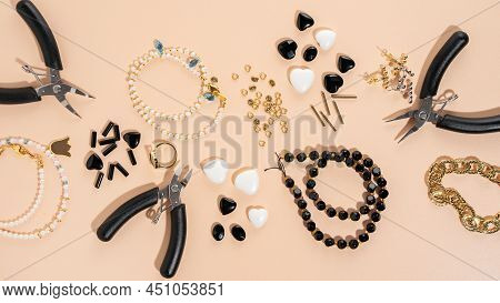 Tools And Accessories For Diy Jewelry In The Workplace. Flat Lay On Beige Background. Creative Flat