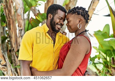Young afircan american couple smiling happy and hugging at the city.