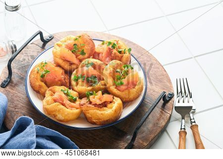 Yorkshire Pudding. Traditional English Yorkshire Pudding With Salmon And Radish Microgreens Side Dis
