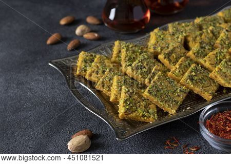 Traditional Persian Dessert Sohan From Iran. Tea Ceremony With Sohan On Dark Gray Background