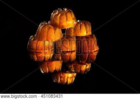Transparent Strawberry Marmalade On A Black Background With Reflection.