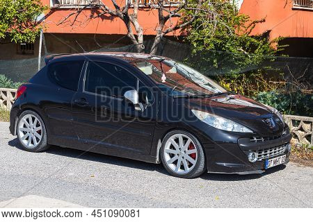 Side; Turkey - March 01 2022: Black Peugeot 207 Is Parked  On The Street On A Warm Day