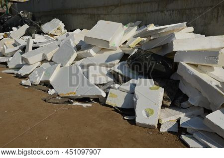Recycling Of Old Polystyrene Boards. Piles Of Damaged Expanded Granule Boards Are Minimally Usable F