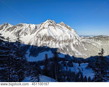 Beautiful Skitour In The Swiss Mountains. Ski Mountaineering. View Of The Mountain Fluebrig And Turn