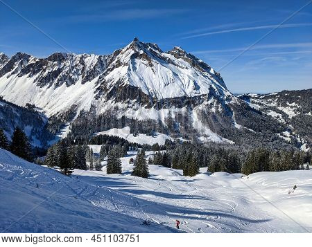 Beautiful Skitour In The Swiss Mountains. Ski Mountaineering. View Of The Mountain Fluebrig And Turn