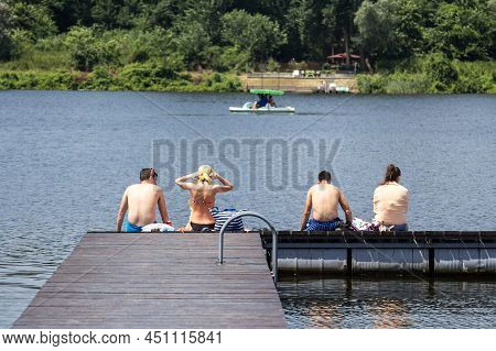 Veliko Gradiste, Serbia - June 26, 2016: Four People In Bathing Suit In Front Of Srebrno Jezero, In 