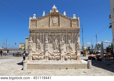 Gallipoli, Italy - May 31, 2017: People Visit Greek Fountain In Gallipoli, Salento Peninsula, Italy.