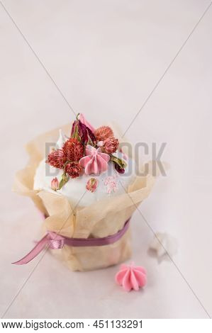 Easter Cake On A Pink Background Decorated With Dried Flowers