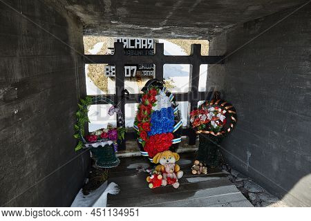 Wreaths, Flowers And Toys Near The Monument. Khatyn State Memorial Complex. Victims Of The Second Wo