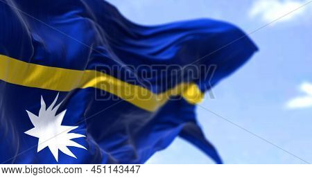 Detail Of The National Flag Of Nauru Waving In The Wind On A Clear Day. Nauru Is An Island Country A