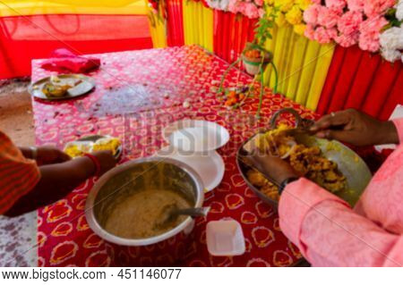 Blurred Image Of Howrah, West Bengal, India. Vog, Prasad, Or Sacred Worshipped Food, Being Distribut