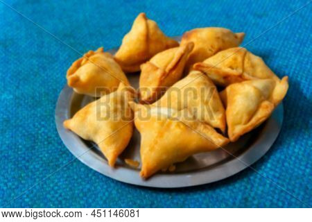 Blurred Image Of Homemade Samosa, Samsa Or Smosa. A Vegetarian Spicy Indian Special Traditional Stre