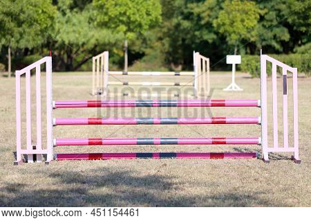 Show Jumping Poles Obstacles, Barriers, Waiting For Riders On Show Jumping Training. Horse Obstacle 