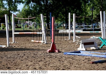 Show Jumping Poles Obstacles, Barriers, Waiting For Riders On Show Jumping Training. Horse Obstacle 