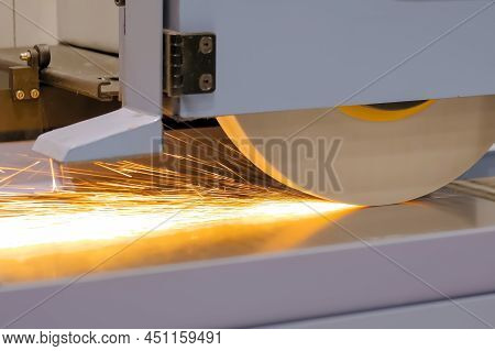Automatic Cnc Surface Grinding Wheel Machine Working With Sheet Metal With Sparks At Factory, Plant.