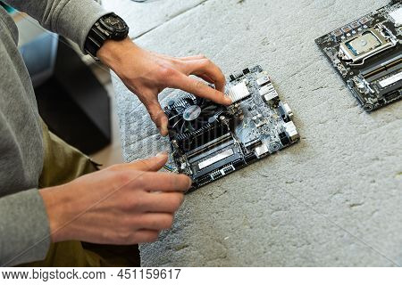 Minsk, Belarus - Dec 15, 2021: Photo Of Hands Assembles A Computer Monitor System Block On An Convey
