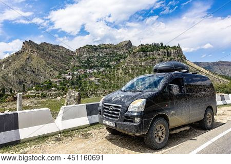 Car On The Background Of A Picturesque View Of The Village Of Gunib. Russia, Dagestan. June 2021