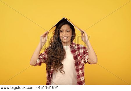 Unhappy School Girl Worry Holding Laptop Computer On Head For Distance Education, Telelearning