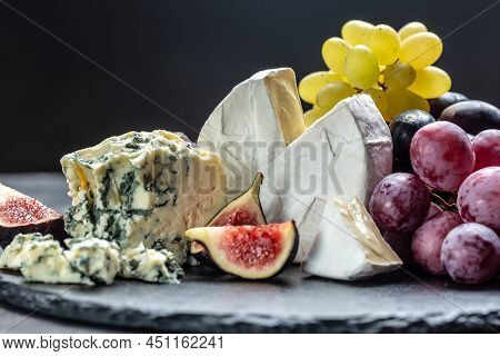 Blue Cheese And Sweet Fruit Figs. Blue Cheese Gorgonzola Picante With Blue Mold From North Of Italy.