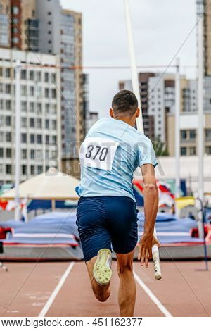 Run-up Male Athlete Pole Vault At Athletics Competition